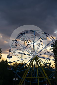 Nursultan, Kazakhstan, August 2022. Ferris wheel against the sunset sky.