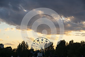 Nursultan, Kazakhstan, August 2022. Ferris wheel against the sunset sky.
