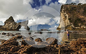 Local Fishermen throwing net to catch fish in Atuh beach when the tide was low in Nusa Penida, Indonesia