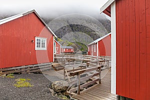 Nusfjord authentic fishing village with traditional red rorbu houses in winter. Lofoten islands, Norway