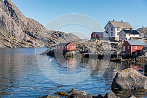 Nusfjord fishing village in Norway. Red fishing huts by the sea.
