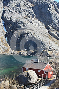 Nusfjord's Rorbuer hidden by the rocks