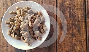 Nut bean fresh in white plate on wooden table