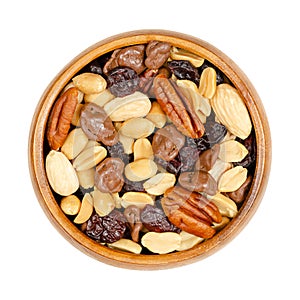 Nut and berry mix, with milk chocolate, snack food in a wooden bowl