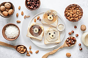 Nut butter banana toast for kids with animal face. Food art, healthy kids meal