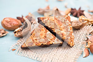 Nut corner, traditional german sweets called Nussecke, covered with chocolate