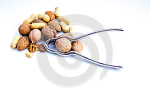 nutcracker and dried fruit composition with walnuts, almonds and peanuts to indicate its benefits