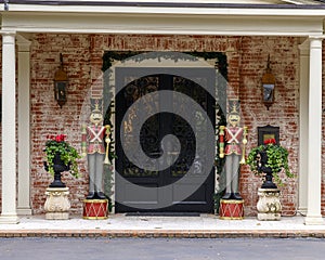 Nutcracker Solidiers holding bugles standing guard protecting a house in Dallas, Texas