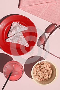 A nutella Two hand pies on a red plate with a glass