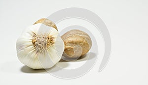 Nutmeg and garlic isolated on white background