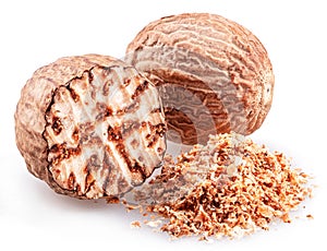Nutmeg and ground nutmeg heap isolated on white background
