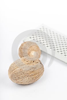 Nutmeg isolated. Whole nut and nutmeg powder isolated on white background