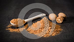 Nutmeg spice powder. Spoon and handful of chopped nutmeg. Nuts. Spices for recipes. Ground spice