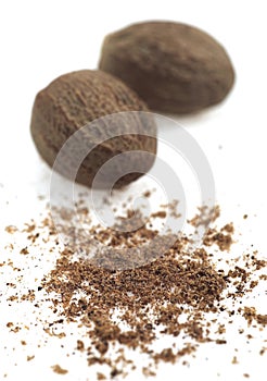 Nutmegs, myristica fragrans, Fruits and Powder against White Background