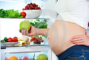 Nutrition and diet during pregnancy. Pregnant woman with fruits