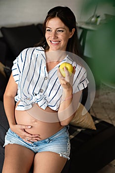 Nutrition and diet during pregnancy. Pregnant woman pays attention to healthy food and vitamins