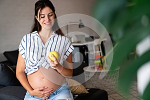 Nutrition and diet during pregnancy. Pregnant woman pays attention to healthy food and vitamins