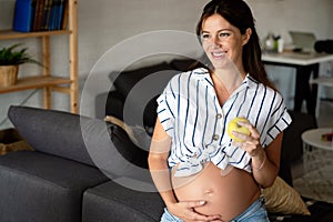 Nutrition and diet during pregnancy. Pregnant woman pays attention to healthy food and vitamins