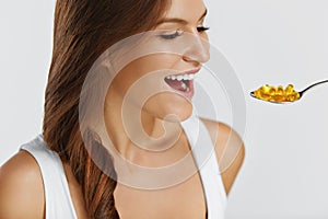 Nutrition. Vitamins. Healthy Eating. Woman Eating Pills With Fish Oil Omega-3. Supplements.