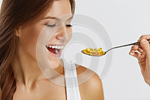 Nutrition. Vitamins. Healthy Eating. Woman Eating Pills With Fish Oil Omega-3. Supplements.