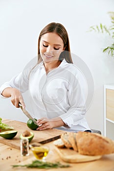 Nutrition. Woman Cooking Healthy Food In Kitchen.