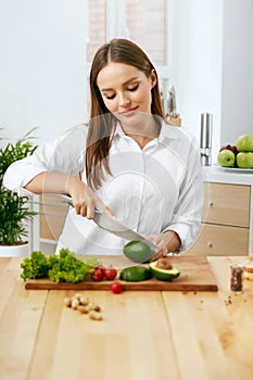 Nutrition. Woman Cooking Healthy Food In Kitchen.