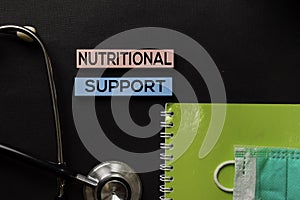 Nutritional Support on top view black table and Healthcare/medical concept