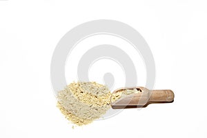 Nutritional yeast flakes in wooden spoon isolated on white background. with copy space for text