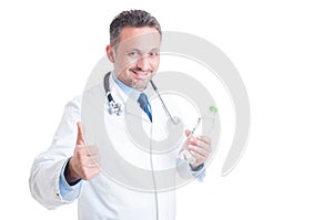 Nutritionist doctor holding bottle of water and showing like