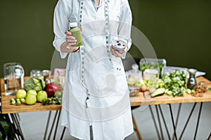 Nutritionist with healthy green food photo