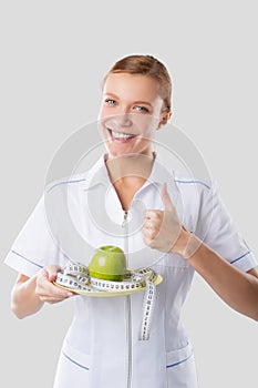 Nutritionist holding hands green apple