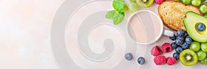 A nutritious breakfast setup with avocado, toast, fresh berries, kiwi, grapes, and a cup of milk tea on a light photo