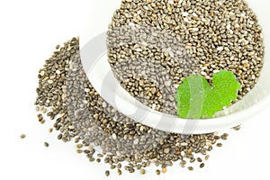 Nutritious chia seeds isolated over a white background