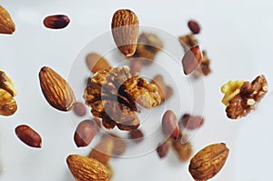 Nuts in the air on a white background, flying nuts. Healthy Brain Food, Diet, Protein, Almonds, walnuts and hazelnuts