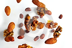 Nuts in the air on a white background, flying nuts. Healthy Brain Food, Diet, Protein, Almonds, walnuts and hazelnuts