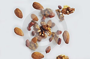 Nuts in the air on a white background, flying nuts. Healthy Brain Food, Diet, Protein, Almonds, walnuts and hazelnuts