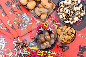 Nuts in the Background of Red Couplet in Spring Festival photo