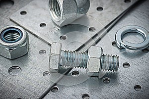 Nuts And Bolts On Metal Plate