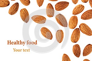 Nuts border of almonds on white background. Pile of selected almond close-up. Isolated.