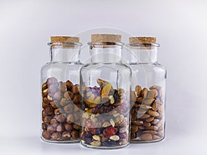 Nuts and dried fruit mix in a glass jars