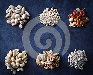 Nuts on grunge background flat lay.