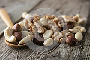 Nuts mix over wooden background. Energy super food. Proteine food. dieting, healthy food. Isolated nuts - almonds