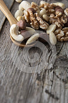 Nuts mix over wooden background. Energy super food. Proteine food. dieting, healthy food. Isolated nuts - almonds