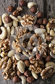 Nuts mix over wooden background. Energy super food. Proteine food. dieting, healthy food. Isolated nuts - almonds