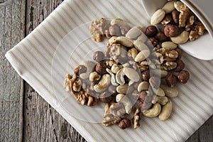 Nuts mix over wooden background. Energy super food. Proteine food. dieting, healthy food. Isolated nuts - almonds
