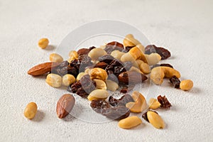 Nuts mixture of almond, cashew, peanut and raisin on table