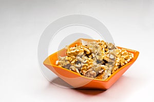 Nuts in orange bowl isolated