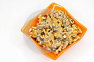 Nuts in orange bowl isolated