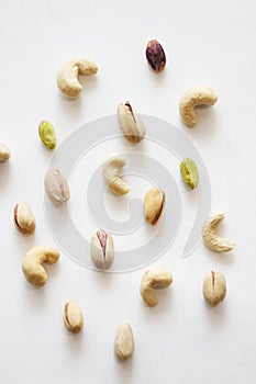 Nuts on white background as pattern, top view.
