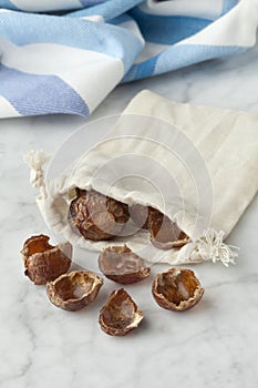 Nutshells of soapnuts in a cotton bag